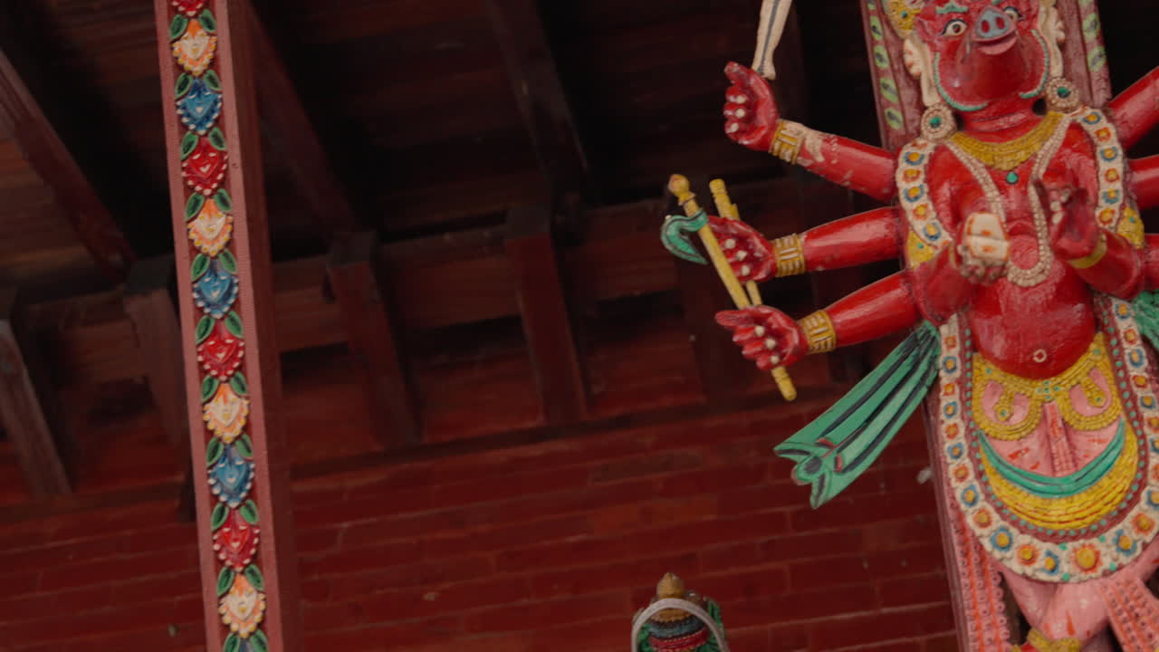 Beautiful wooden carving of a goddess from Nepal, showcasing the nation’s rich craftsmanship, spirituality, and colorful cultural vibrance seen in traditional temple art and heritage