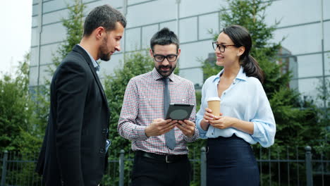 business team discussing project outdoors