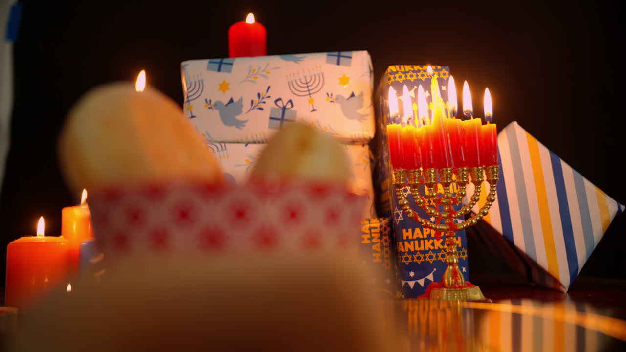 Lit Menorah with Gifts for Hanukkah Celebration