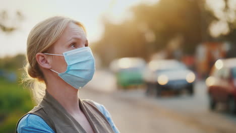 Dirty-Air---A-Woman-In-A-Gauze-Bandage-Stands-Near-A-Road-Loaded-With-Vehicles-Ecology-Problems-Conc