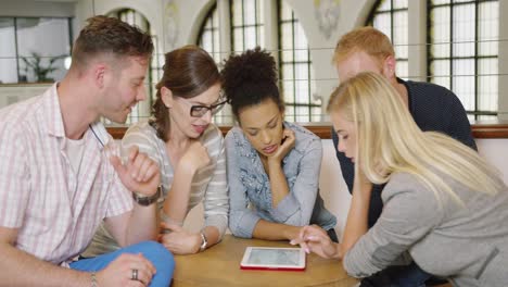 colleagues around table choosing new ideas