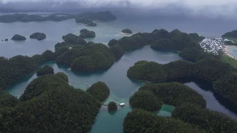 awe-inspiring aerial perspective of barangay caub kangbangyo, showcasing its mesmerizing turquoise lagoons in the philippines