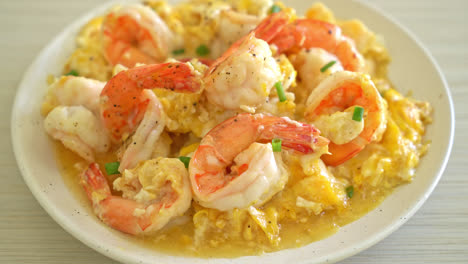 homemade creamy omelet with shrimps or scrambled eggs and shrimps