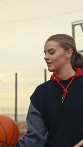 woman juggling a basketball