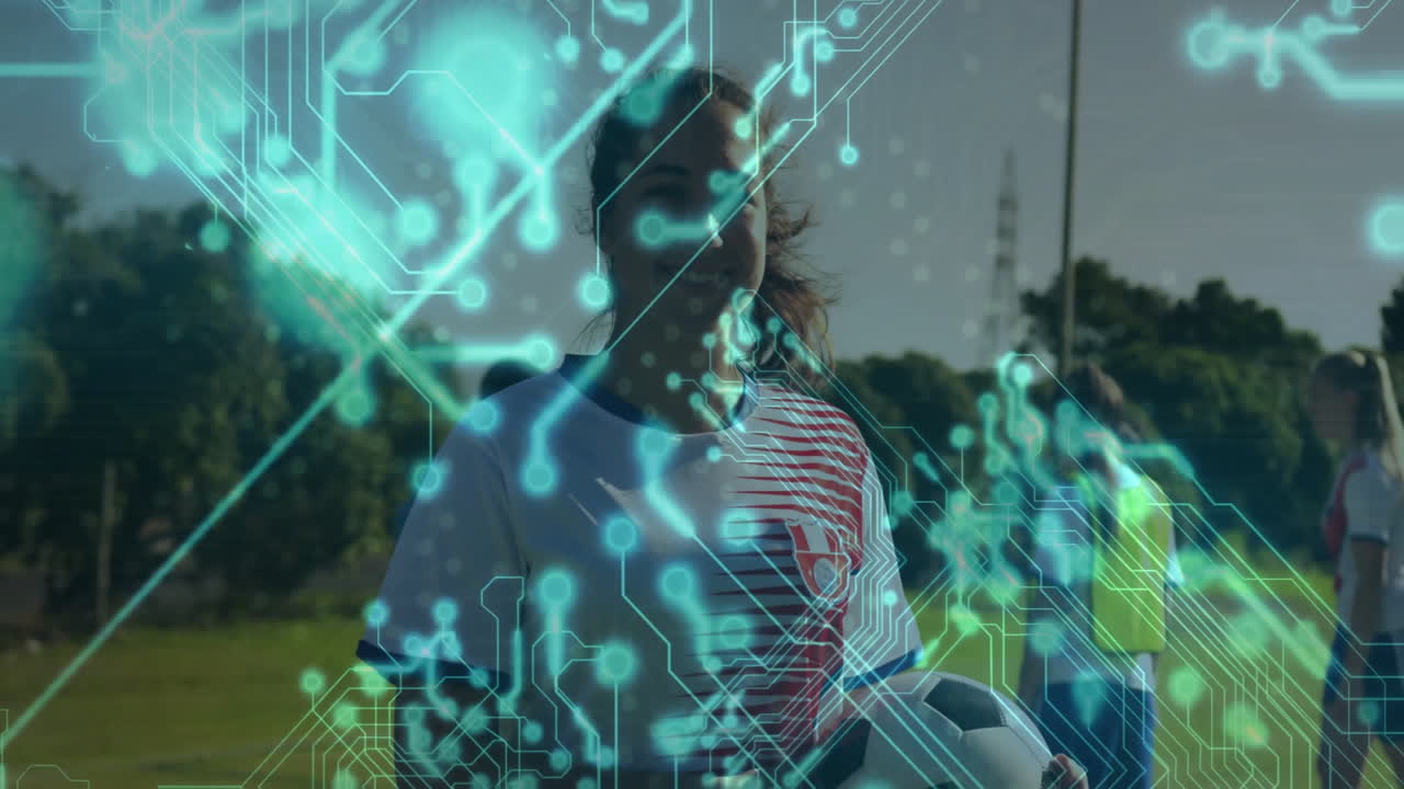 Young athlete holding soccer ball with digital network animation overlay