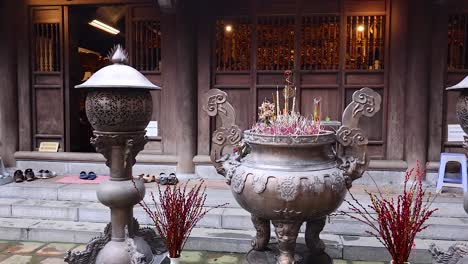 a serene temple courtyard with incense burners