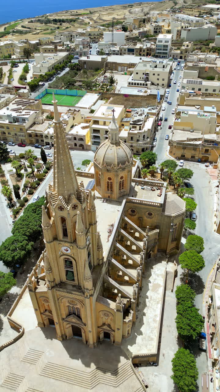 Aerial drone view of the Gozo island in Malta, in the Mediterranean Sea. Vertical