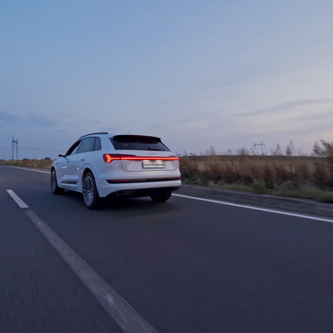 electric car audi e-tron - new model car presentation. eco-friendly alternative energy concept