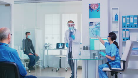 nurse giving doctor patient radiography