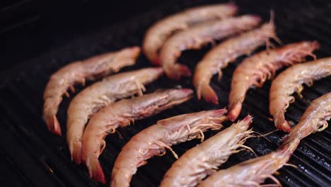 shrimp being cooked on a hot grill