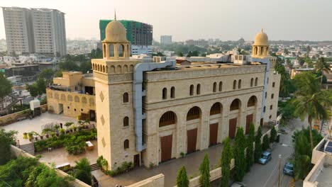 beautiful drone shot sideview of al masjid al burhani during sunny day in karachi, pakistan