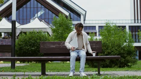 man working on laptop outdoors