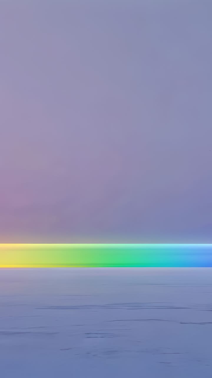 Vertical video: After three seconds, mist drifting across dusk sea, softening rainbow band
