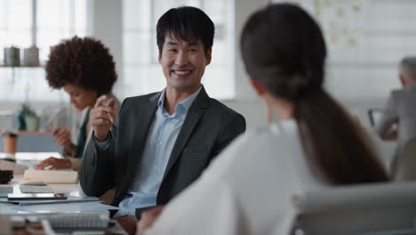 professional-asian-businessman-chatting-to-intern-discussing-job-interview-colleagues-having-conversation-in-office-enjoying-teamwork