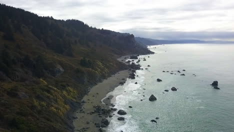 wide drone shot of northern california coast, birdseye view of ocean and forests