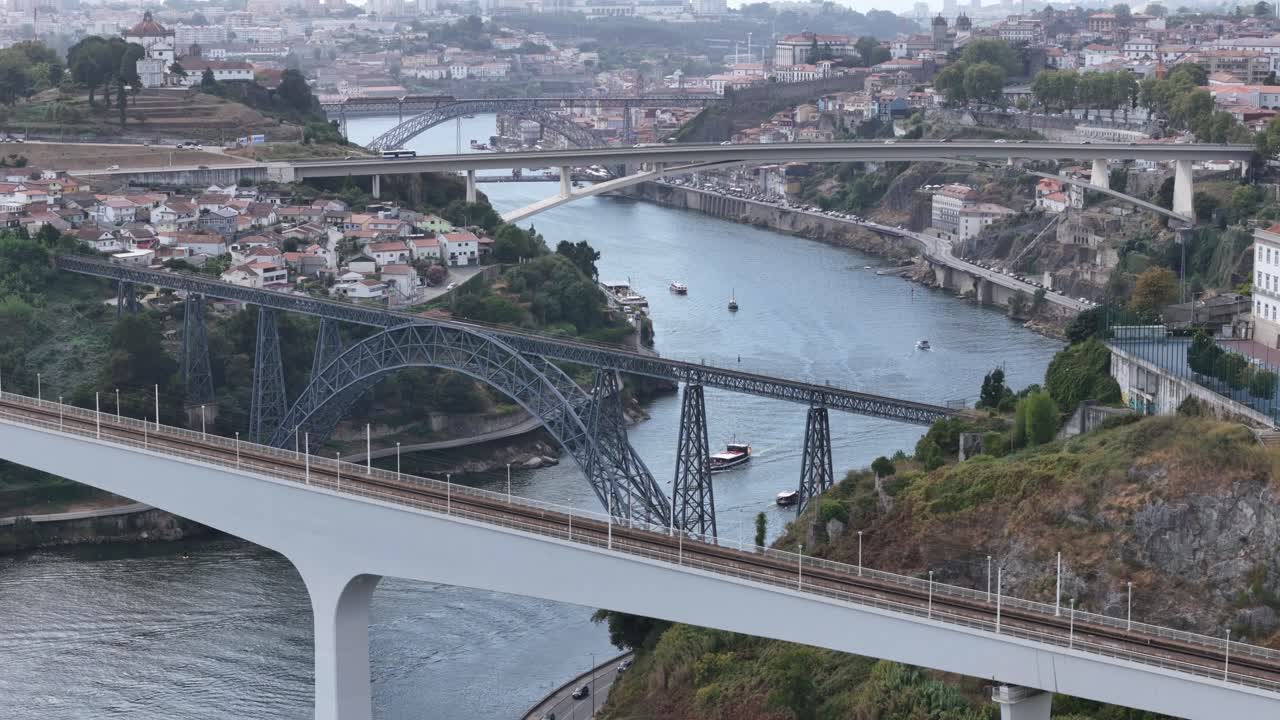 Douro river with bridges and boats in Porto with 70mm on a drone