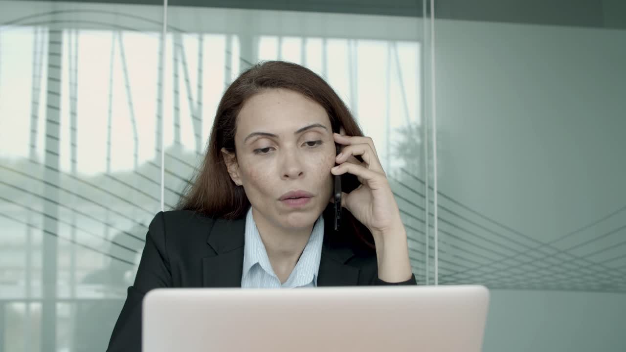 Positive female manager talking to customer