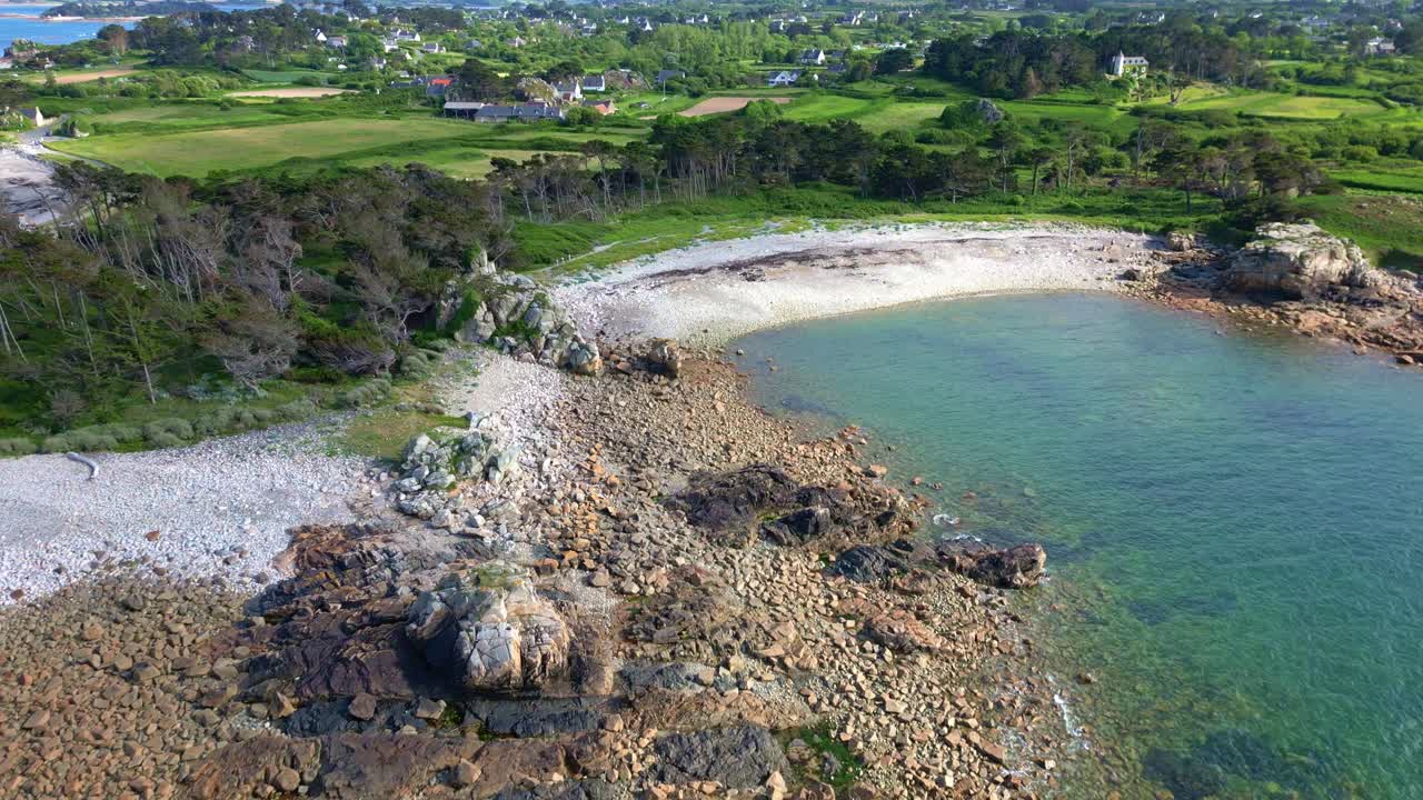 Beauty rocky cove along the Pointe du Castel with Indian Rock stone cliffside, Côte de Granit Rose, Brittany, France.