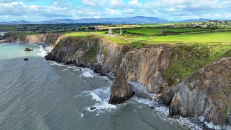 ireland epic locations sunlight drifting along the land behind the sea cliffs at copper coast waterford ireland