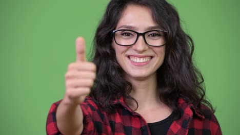 young beautiful businesswoman giving thumbs up