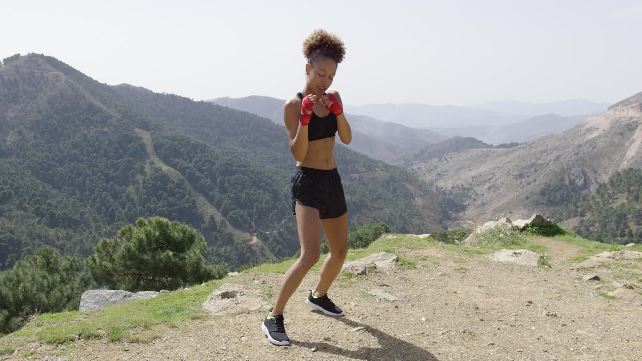 Young fit girl in boxing gloves