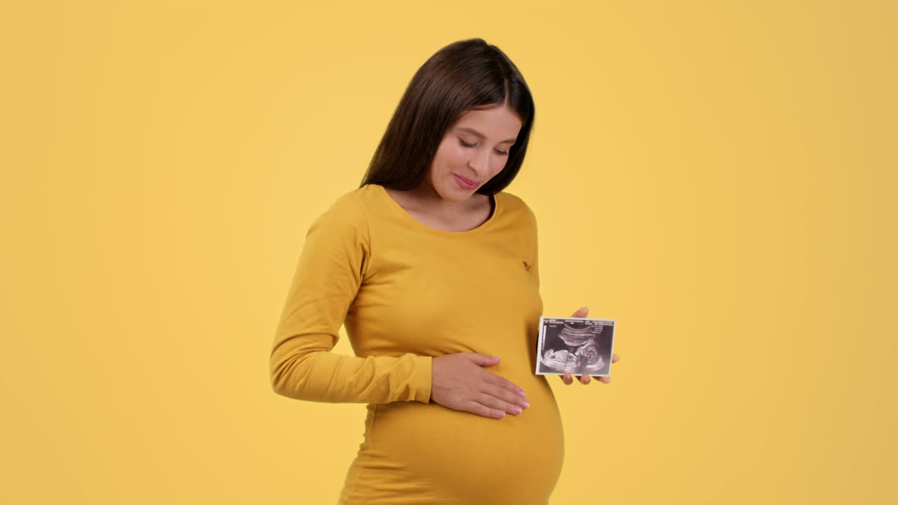 Pregnant Woman Looking at Ultrasound
