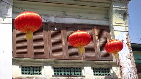 red lantern hanging at old heritage house