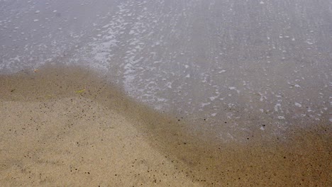 ocean waves on sandy beach