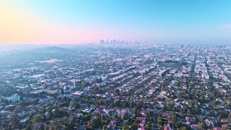 hollywood residential neighborhood - drone flight towards downtown los angeles skyline