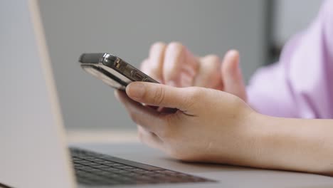 a young businessman is taking a video conference and touchscreen with customers via a smart phone connected to the internet.