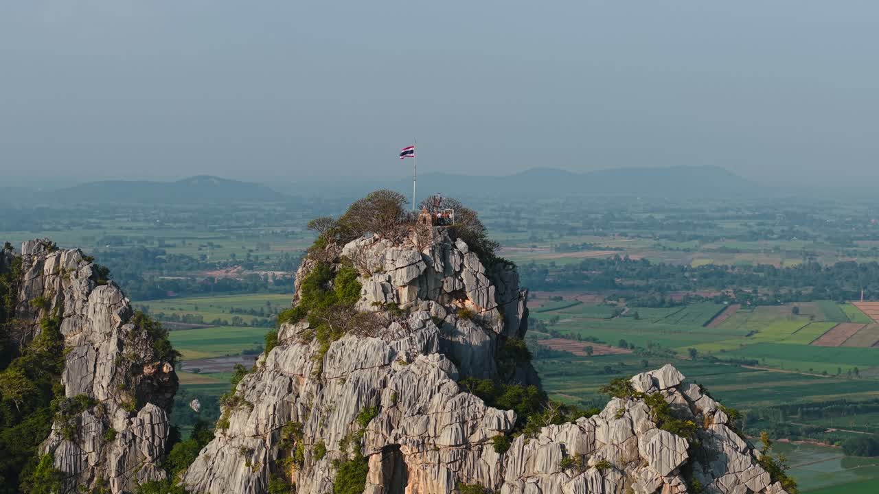 Thai Flag on Mountain Summit, Overlooking a Landscape