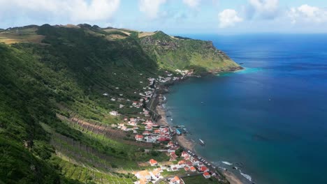 praia de são lourenço on santa maria island, featuring lush green hills and turquoise waters, aerial view