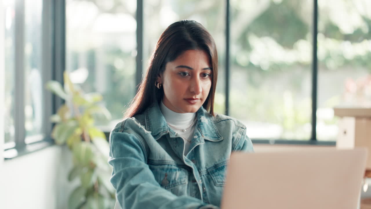 Excited woman celebrating indoors