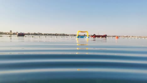 Summer-morning-with-calm-waters-of-Adriatic-and-floaties-waiting-for-kids-to-wake-up