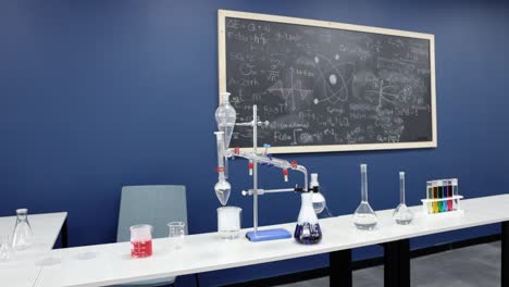 in a deliberate slow-motion display, a science laboratory teems with activity as glass beakers undergo captivating reactions, spotlighting the precision of chemical investigations