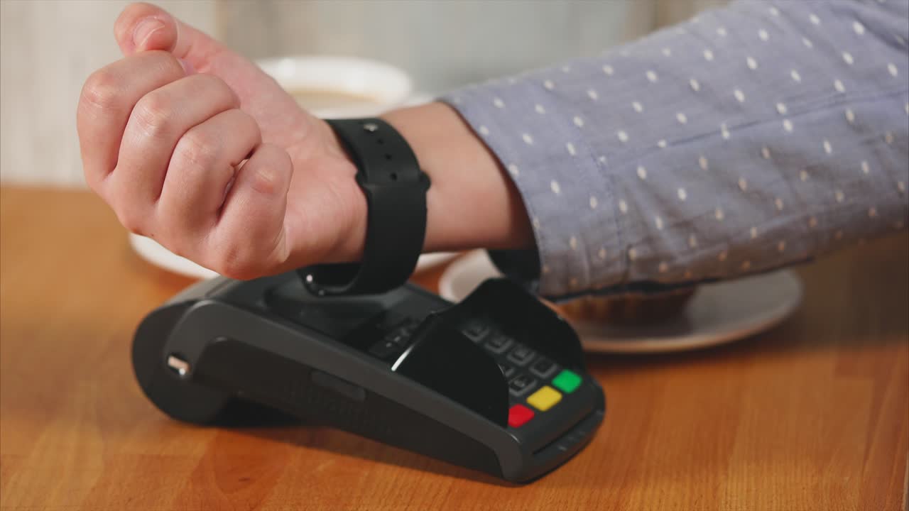 Using smartwatch for contactless payment at a cafe