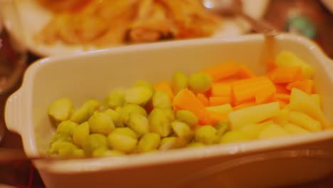 Brussels sprouts, carrots in a bowl and warm turkey on a plate Irish Christmas