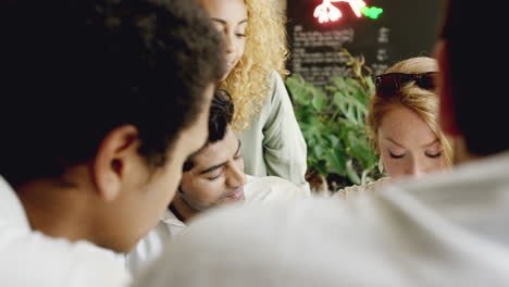 Small-Business-team-meeting-global-sharing-economy-tablet-touchscreen-cafe