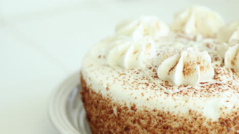 Pumpkin-spice-cake-sitting-on-a-clean-white-counter-during-the-beginning-of-the-fall-season