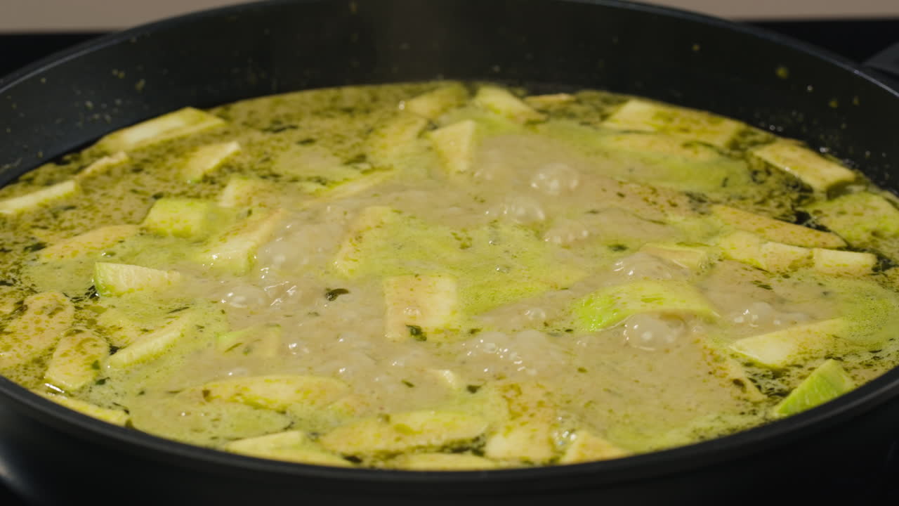 Zucchini cooking in a pan