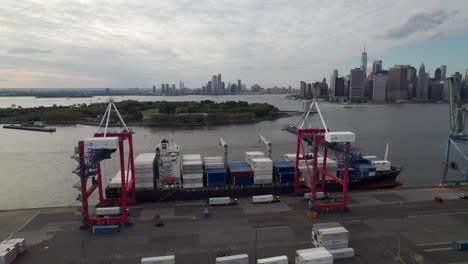 cargo ship being loaded in brooklyn navy yard, new york