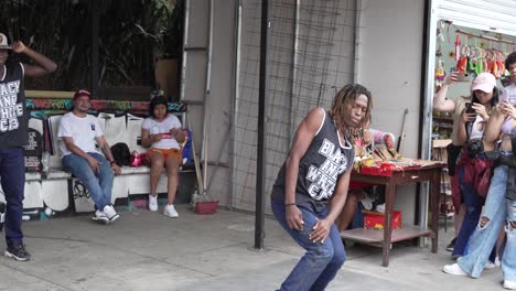 breakdancer performing for crowd in famous comuna 13