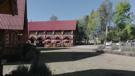 flying through wooden house cottages in distant village, mexico