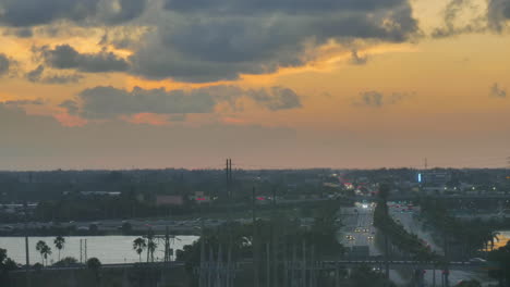 sun setting behind miami interstate near the airport, timelapse