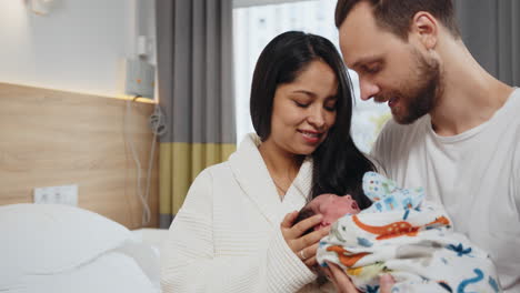 newborn baby in hospital with parents