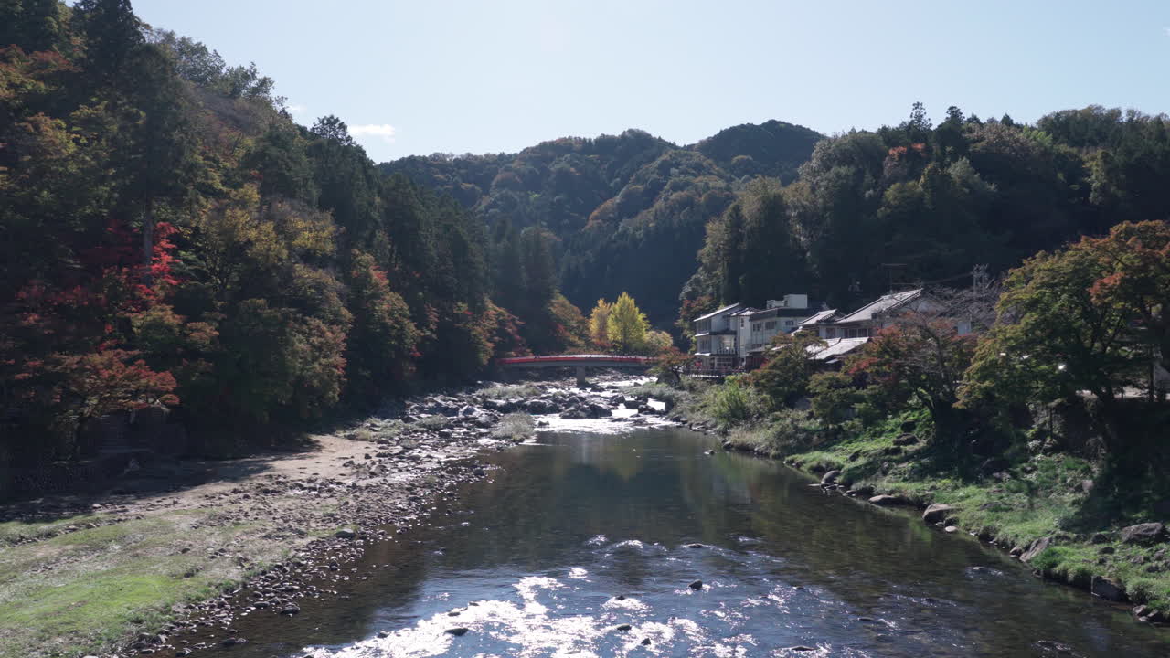 Taigetsu bridge across Tomoe river at Korankei gorge during autumn season
