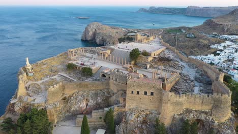 Aerial-drone-shot-above-ruins-of-Acropolis-of-Lindos,-Rhodes,-Dodecanese-Islands,-Greek-Islands,-Ancient-architecture-of-Rhodes,-Greece
