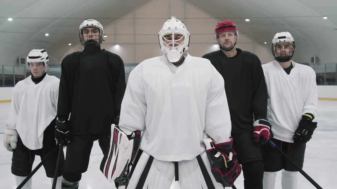 Portrait Of Male Hockey Players In Helmets