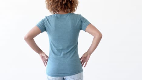 Midsection-of-african-american-woman-wearing-blue-t-shirt-with-copy-space-on-white-background