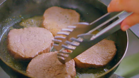 cooking fillet mignon on a pan